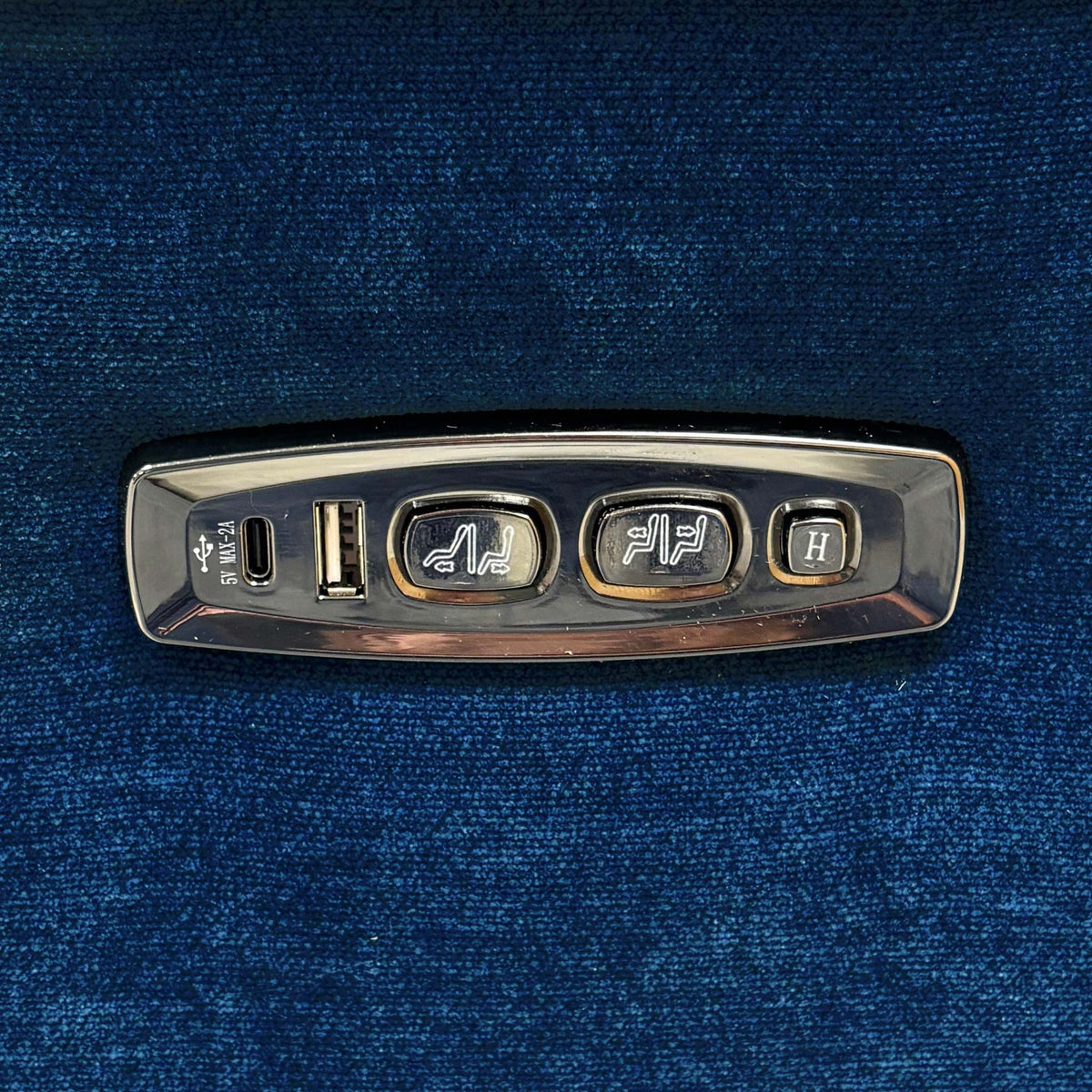 Close-up of the Nova sofa power control panel with recline and headrest buttons, USB-C and USB ports