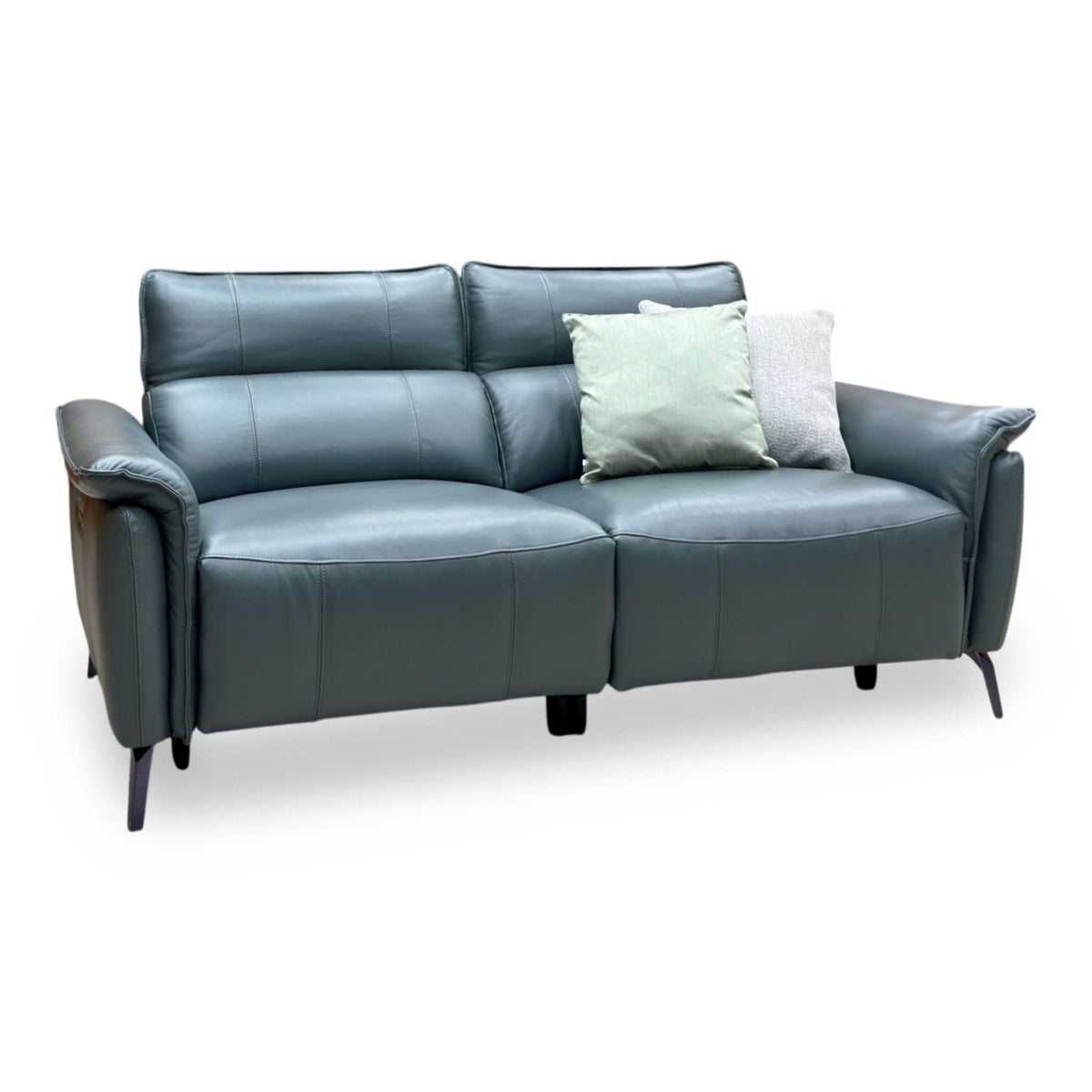 Jude Oslo peacock green leather sofa, angled view with headrests up and scatter cushions
