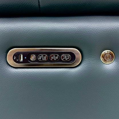 Close-up of the Jude peacock green leather sofa control panel with USB port and power buttons
