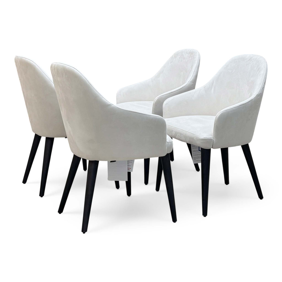 Stone International Blade set of 4 white suede fabric dining chairs with black tapered legs, angled view