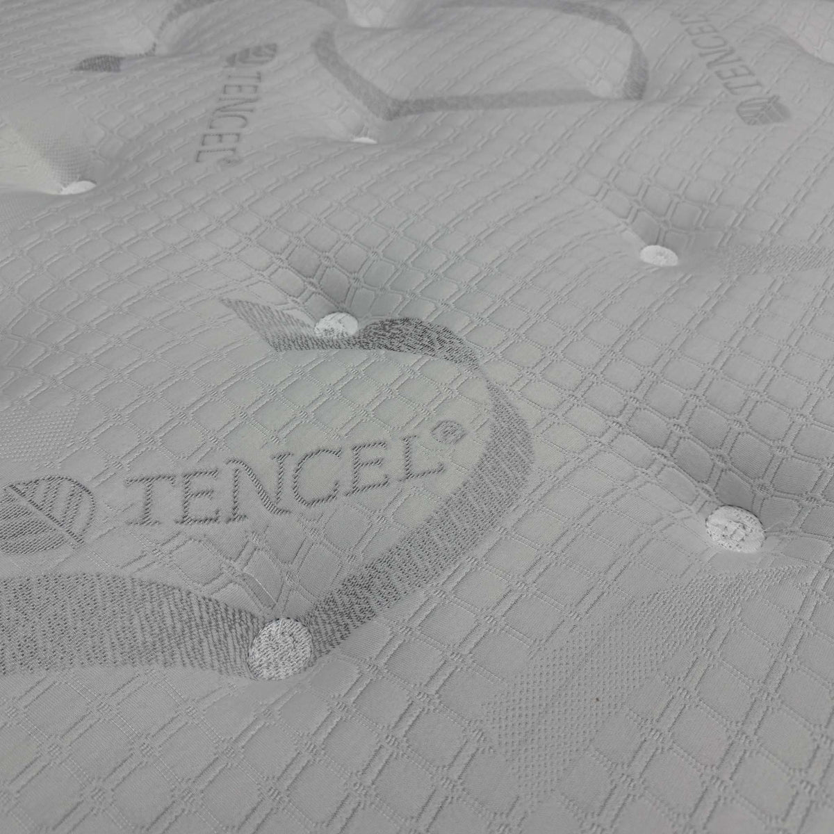 Close-up of the tufted Tencel-branded quilted cover on the Bliss 1500 pocket orthopedic mattress