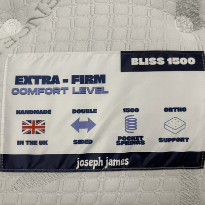 Close-up of the Bliss 1500 mattress label showing extra-firm comfort level, double sided and ortho support