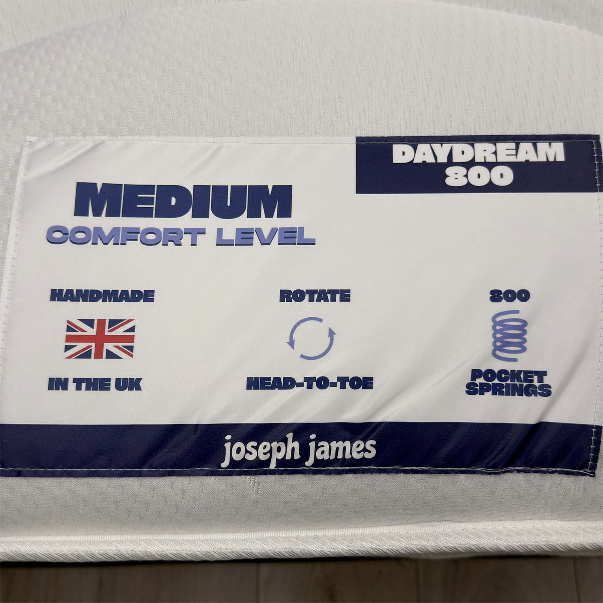 Daydream 800 mattress label showing medium comfort level, handmade in the UK, rotate head-to-toe, 800 pocket springs