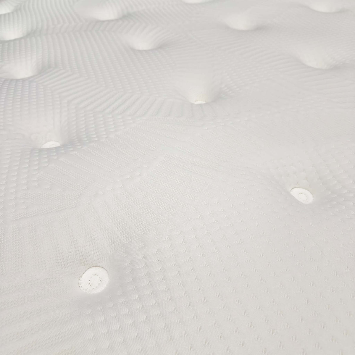 Close-up of the tufted quilted cover on the Gentle 1000 pocket memory mattress