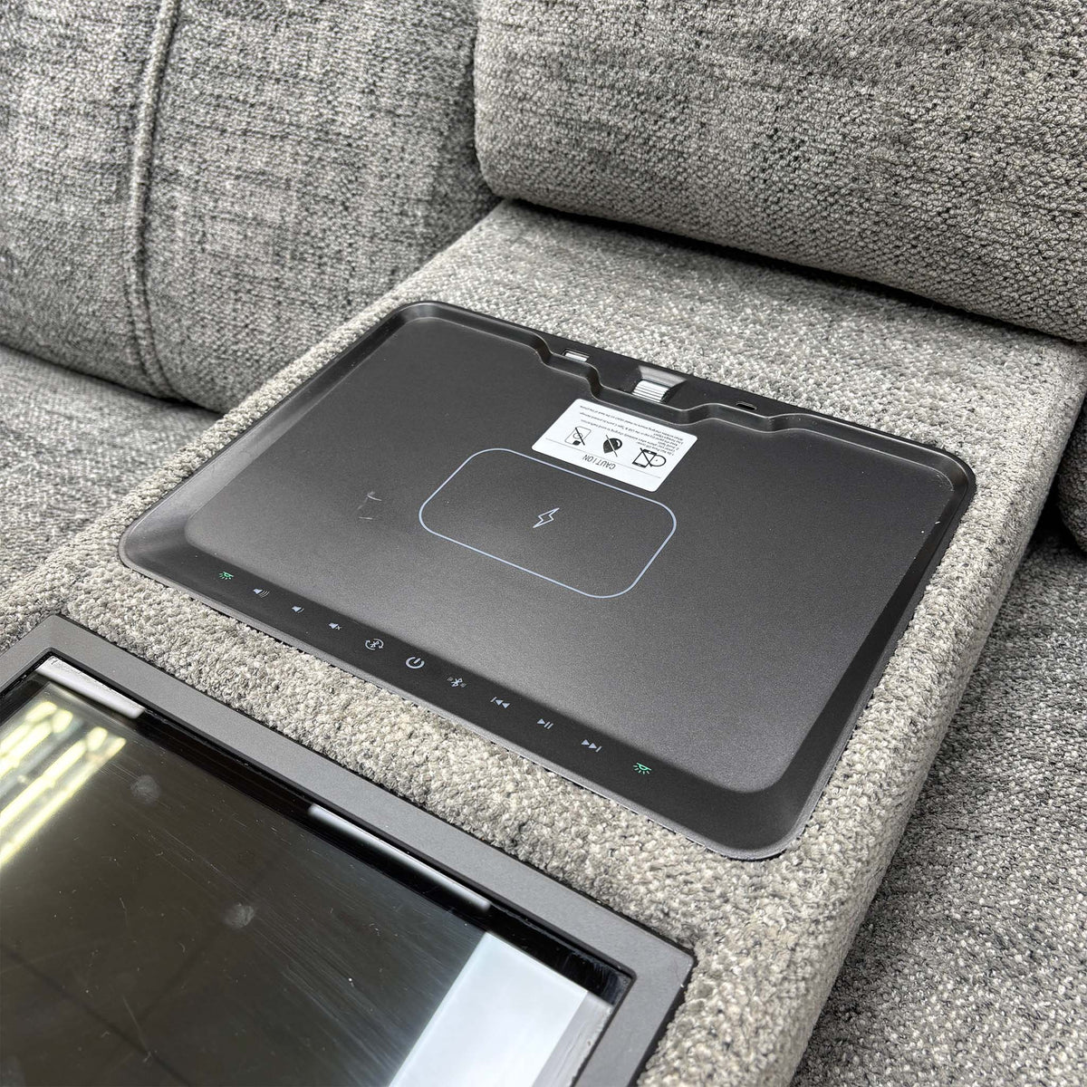 Hollywood media sofa console lid open showing the wireless charging pad and touch control strip