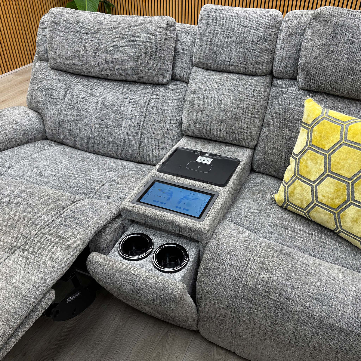 Hollywood dove grey fabric media sofa centre console open showing the touchscreen panel and two cup holders