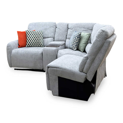 Darren light grey fabric chaise sofa, angled from the right showing the open-ended chaise and media console
