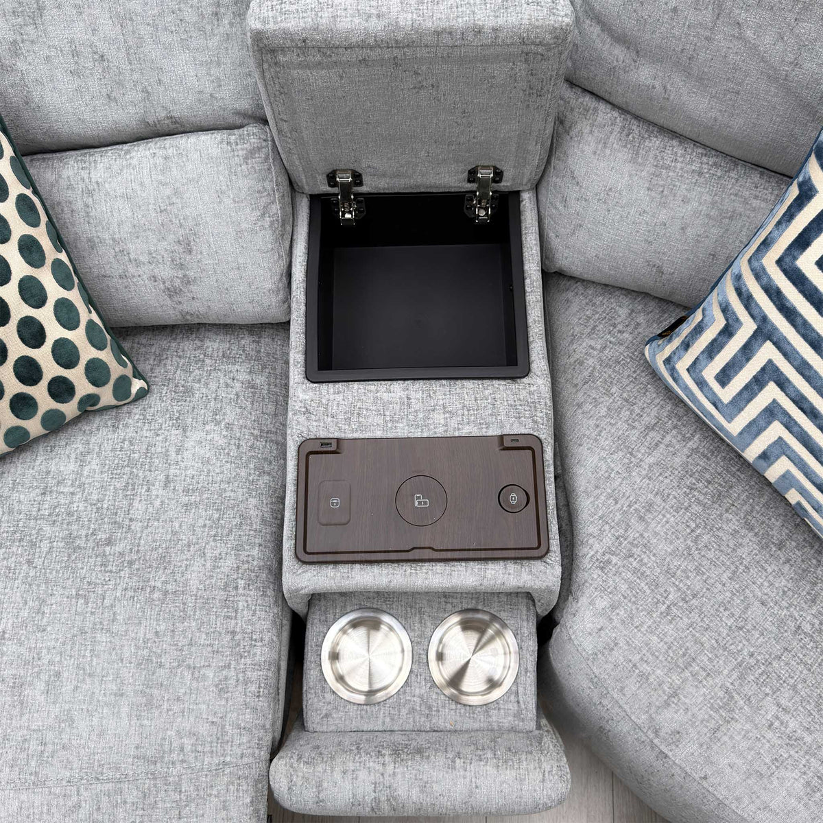 Top view of the Darren media console with open storage, wireless charging pad and two cup holders