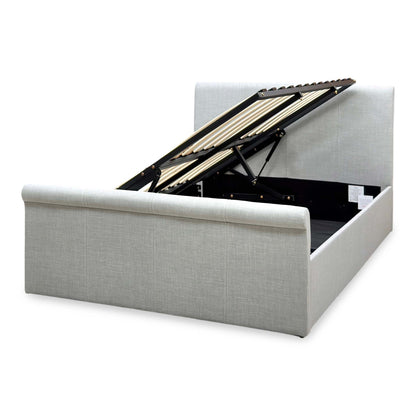 Stanley grey fabric ottoman bed open storage seen from the foot end, slatted base lifted on its gas struts