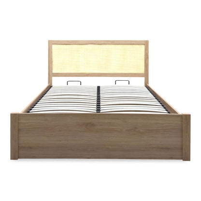 Front view of the Hamish oak king size end lift ottoman bed with the rattan headboard