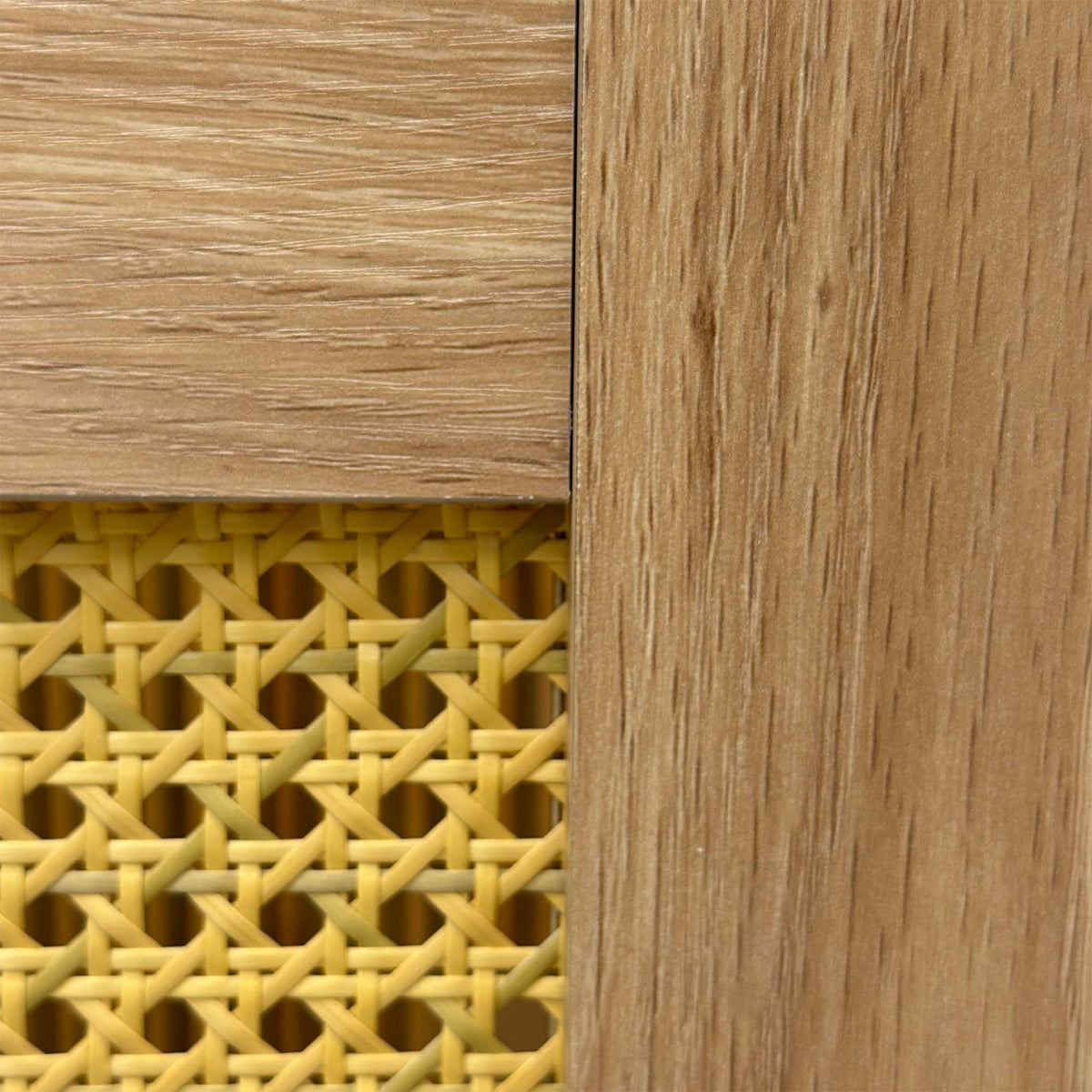 Close-up of the woven rattan headboard panel and oak frame on the Hamish ottoman bed