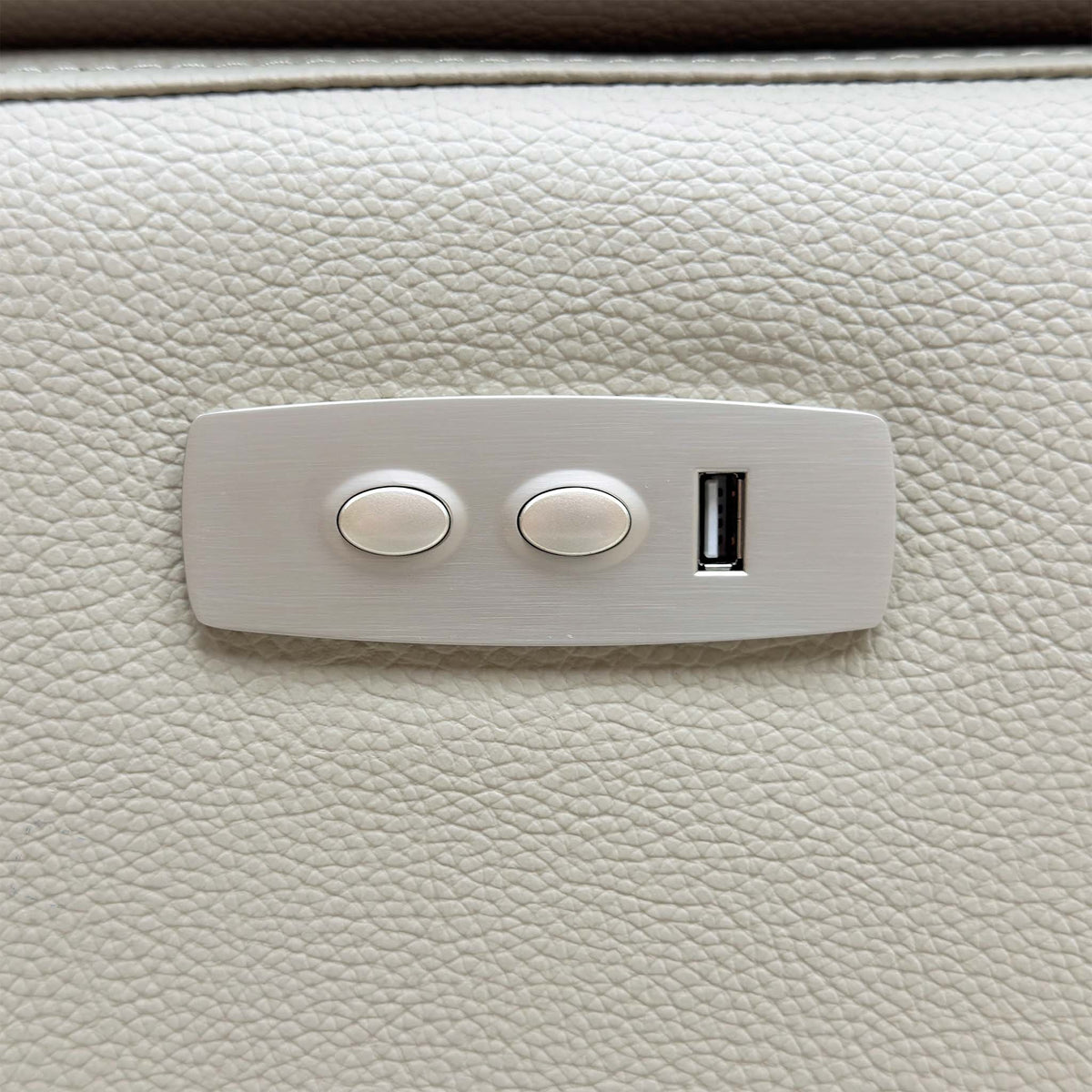 Close-up of the power recline control panel with two buttons and a USB port on the Pavilion sofa arm
