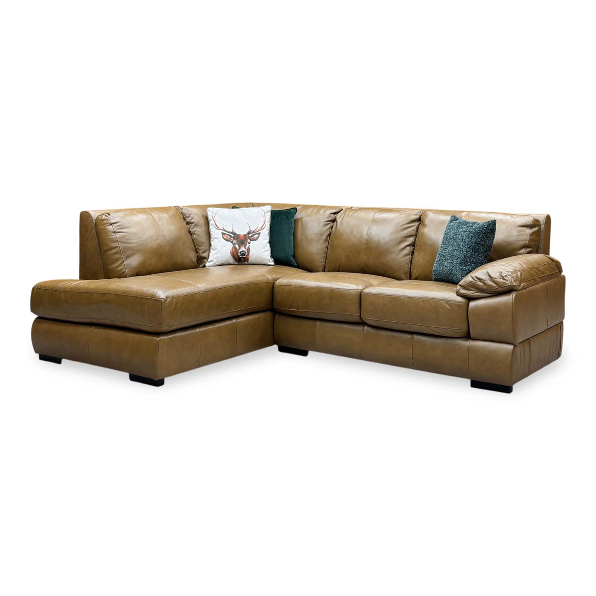 Marlow tan brown leather left hand corner chaise sofa, angled view with stag and teal scatter cushions