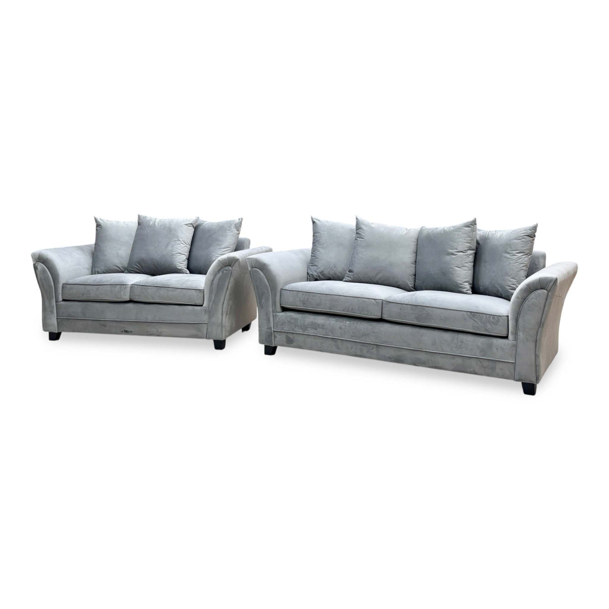 Side angle of the Leila grey velvet 3 + 2 seater sofa set showing the scatter back cushions