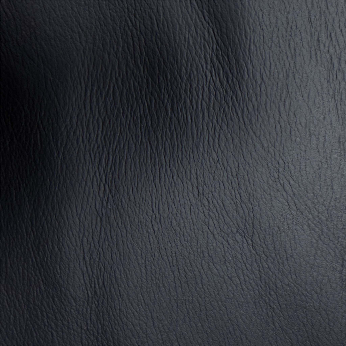 Close-up of the black grained faux leather used on the Leighton recliner sofa