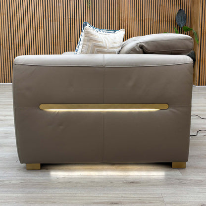 Back view of the Edison taupe leather sofa showing the LED light strip lit across the back panel