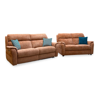 Nicoletti Vito orange fabric 3 seater power recliner sofa and 2 seater, angled view with teal cushions