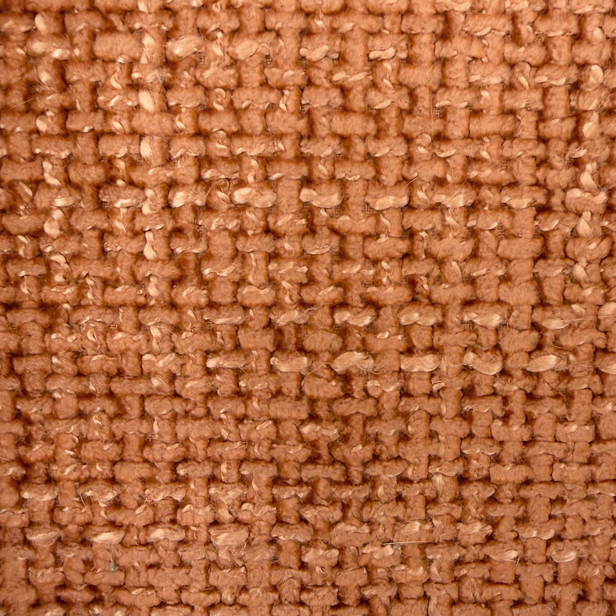 Close-up of the orange woven fabric used on the Nicoletti Vito power recliner sofa