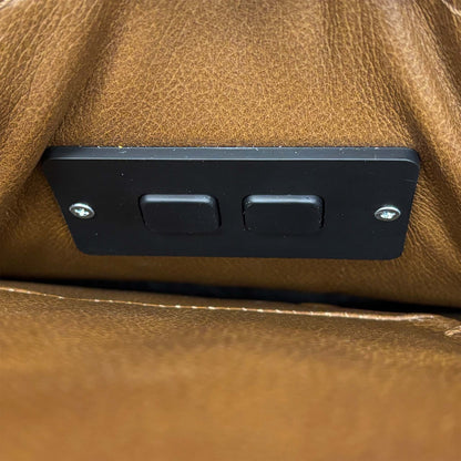 Close-up of the two-button power recline switch on the inside arm of the Marinelli Viali sofa