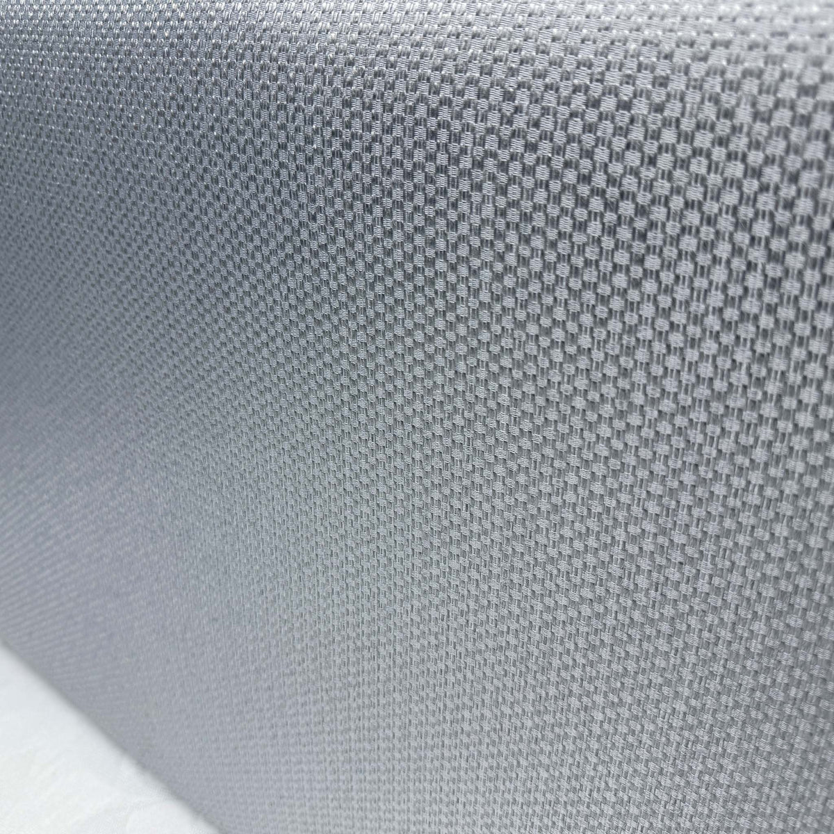 Close-up of the grey woven fabric used on the Gus guest bed divan base