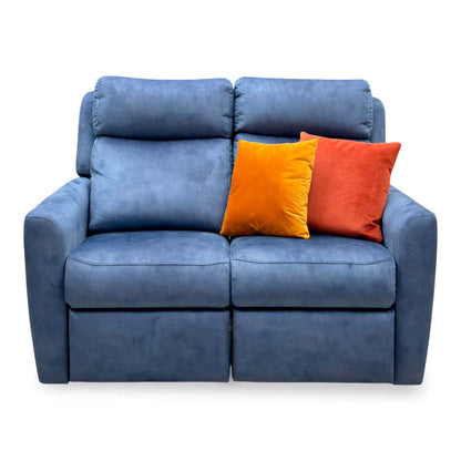Front view of the G Plan Wren indigo velvet 2 seater sofa with high padded headrests and two orange cushions