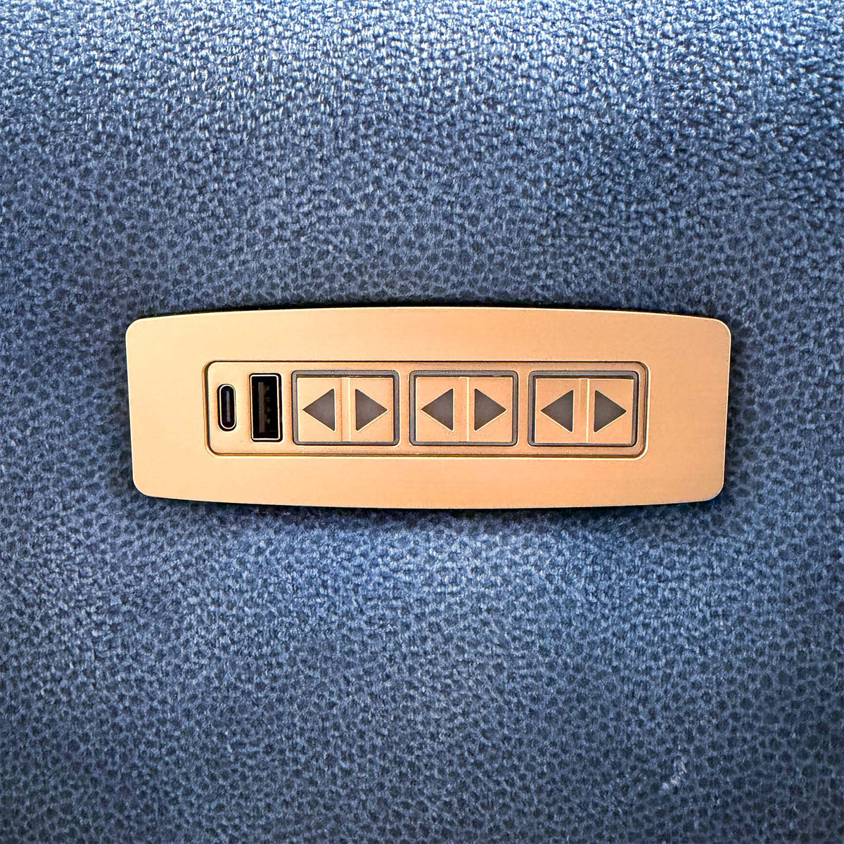 Close-up of the G Plan Wren sofa metal control panel with three recline switches and USB and USB-C ports