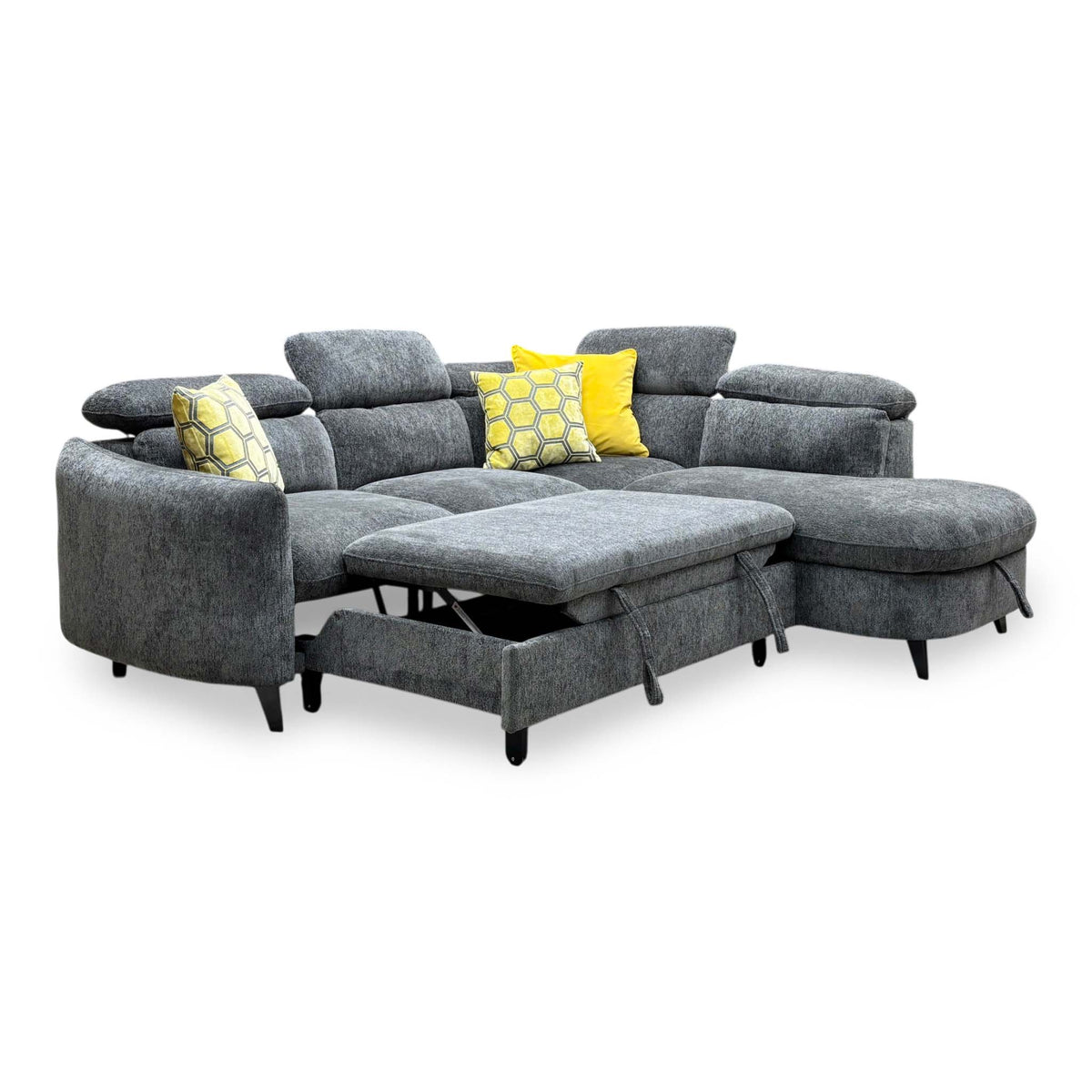 Snooze charcoal grey chenille corner sofa bed with the pull-out bed section extended, angled view