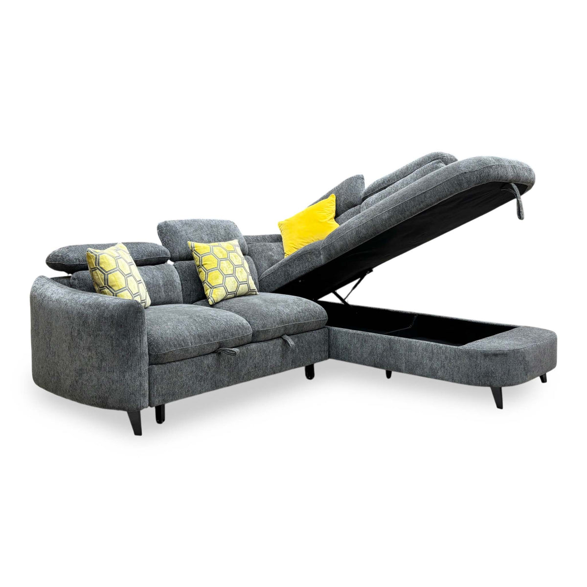 Snooze charcoal grey chenille corner sofa bed with the chaise end lifted to show the storage space, angled view