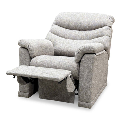 G Plan Malvern oatmeal fabric recliner chair from the side with the footrest raised, showing the recline mechanism