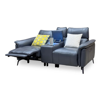 Jude lavender grey leather recliner with the left seat reclined and the console charging tower raised