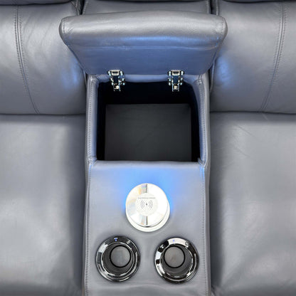 Close-up of the Jude recliner smart console open, with wireless charging tower and two cup holders