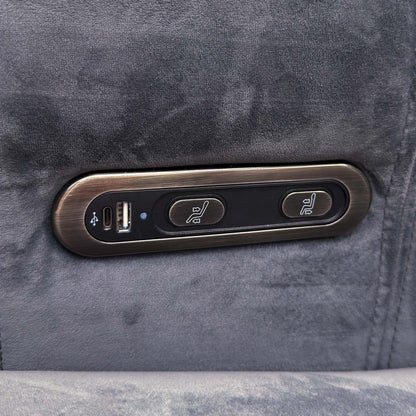 Close-up of the power recline buttons and USB port on the arm of the Elphaba granite grey velvet sofa