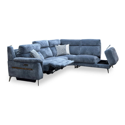 Eclipse silverish blue fabric corner sofa with a seat power reclined and the chaise end storage lid lifted open