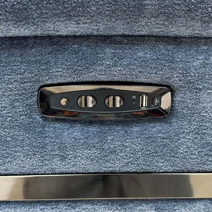 Close-up of the power recline and headrest control panel with USB port on the arm of the Eclipse sofa