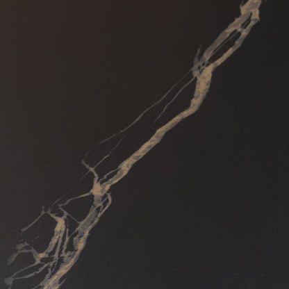 Close-up of the gold veining on the black sintered stone top of the Osiris dining table