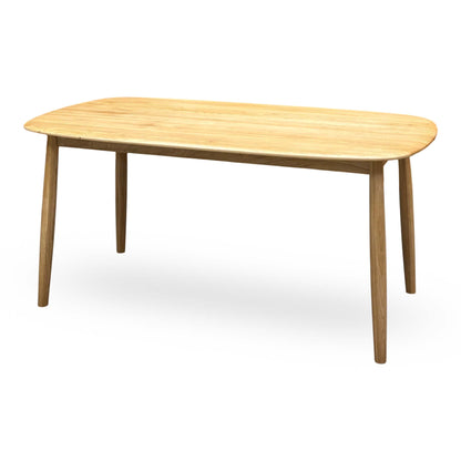 Stockholm light oak solid oak dining table, angled view from the right showing the oval-edged top