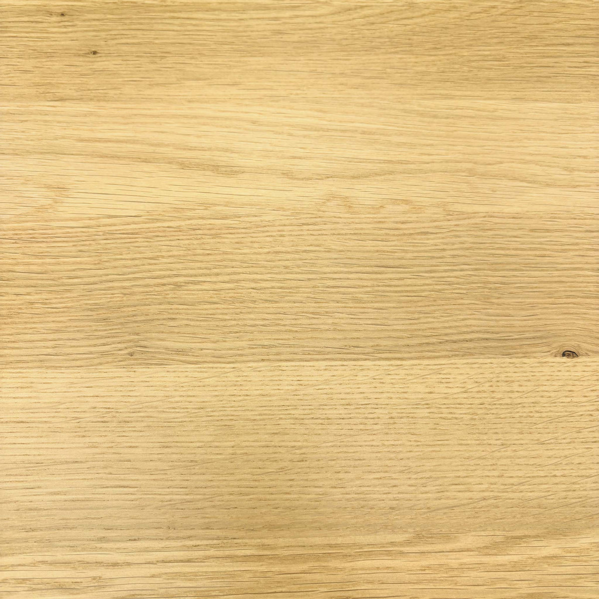 Close-up of the light oak grain used on the Stockholm solid oak dining table top