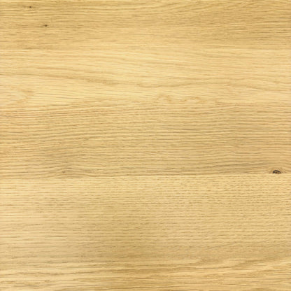 Close-up of the light oak grain used on the Stockholm solid oak dining table top