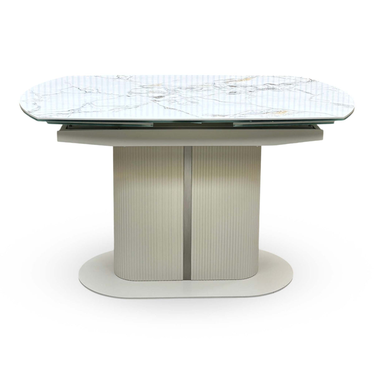 Front view of the Avorio ceramic top swivel extending dining table closed, showing the ribbed cream pedestal