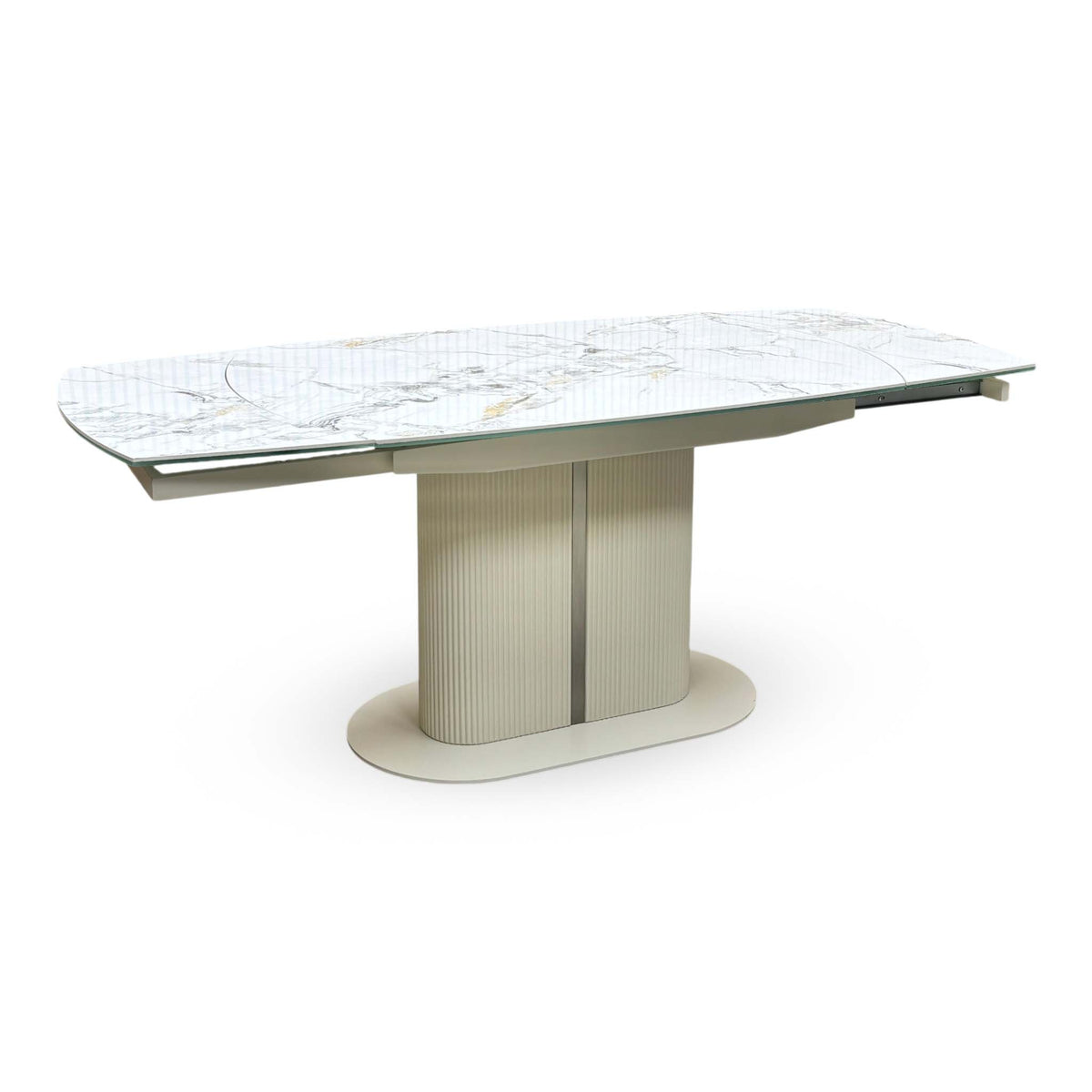 Avorio white marble-effect ceramic top swivel extending dining table fully extended, angled view on a cream pedestal