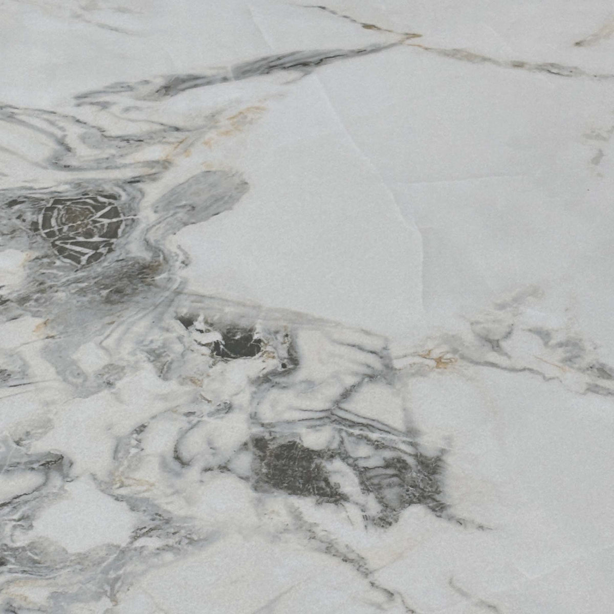 Close-up of the white marble-effect ceramic with grey veining used on the Avorio dining table top