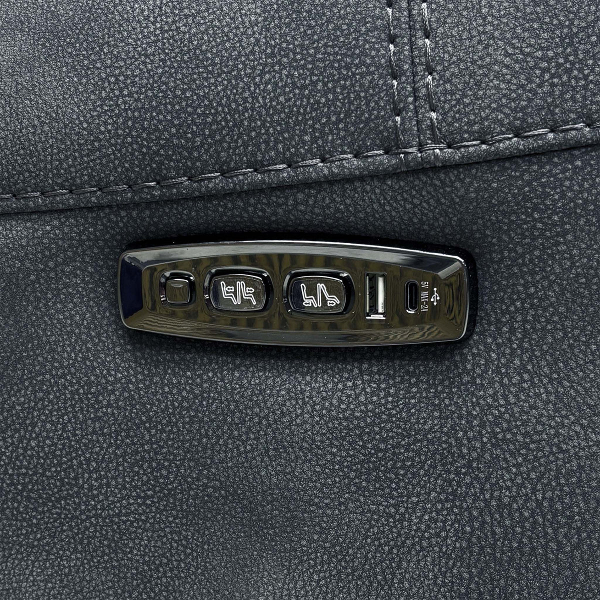 Close-up of the power recline and headrest control panel with USB ports on the Link charcoal grey sofa