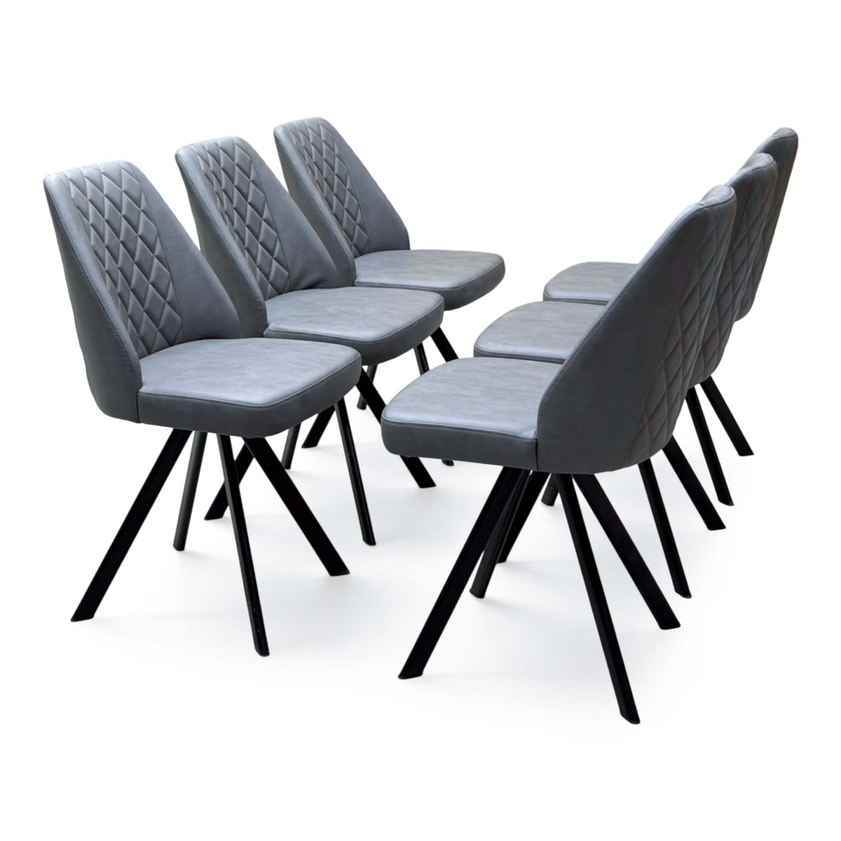 Set of 6 Jupiter grey faux leather swivel dining chairs, angled view from the right with diamond stitched backs