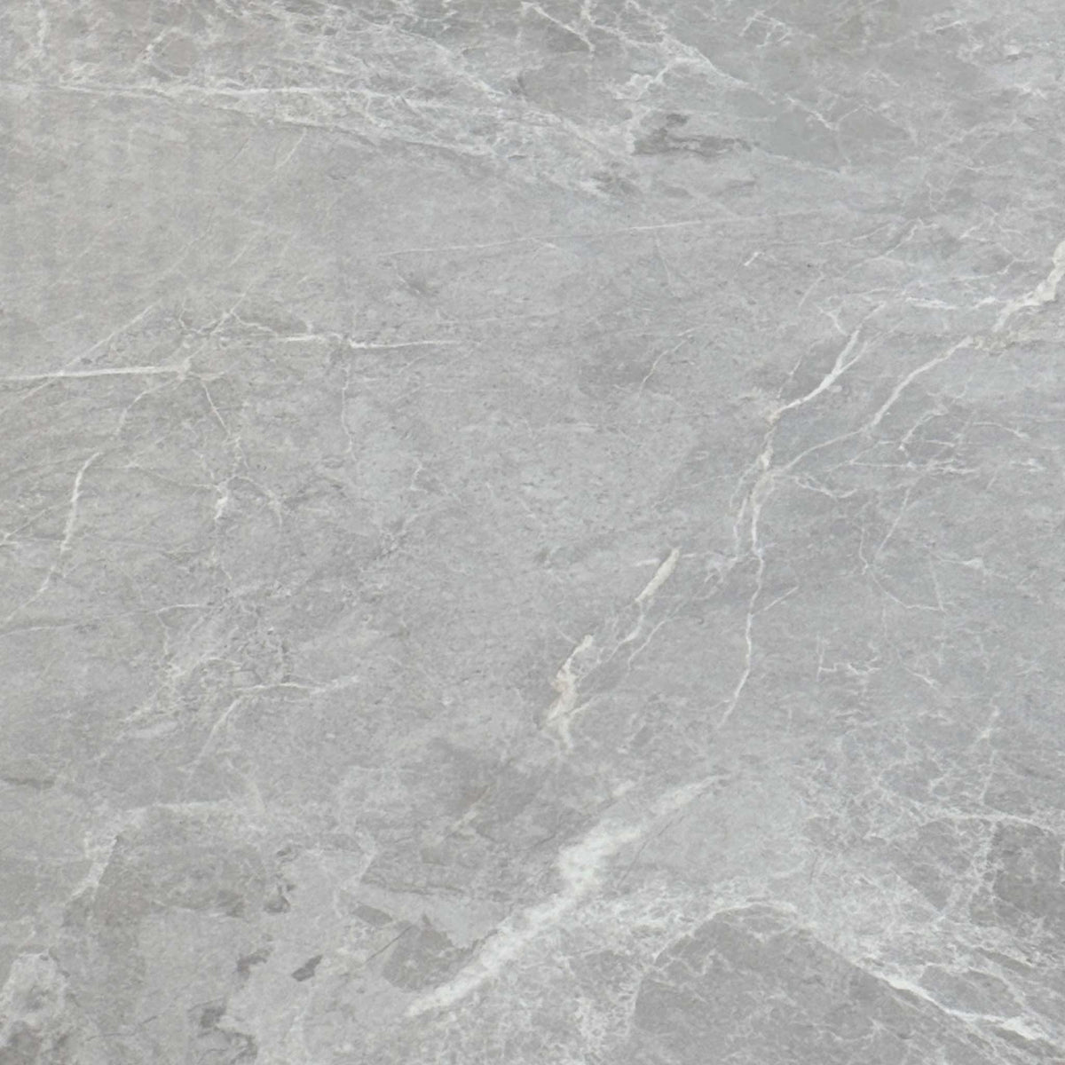 Close-up of the grey marble-effect finish used on the Fumo high gloss dining table top