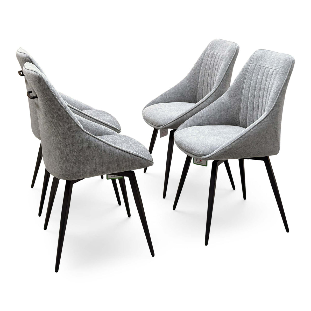 Crete light grey fabric set of 4 dining chairs with fluted backs and black metal legs, angled from behind