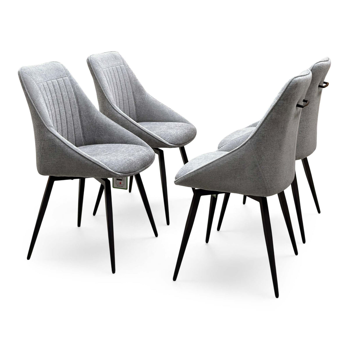Crete light grey fabric set of 4 dining chairs, angled view with fluted back stitching and black metal legs