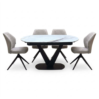 Julio grey-veined marble ceramic dining table with four cream fabric swivel chairs around it, front angle