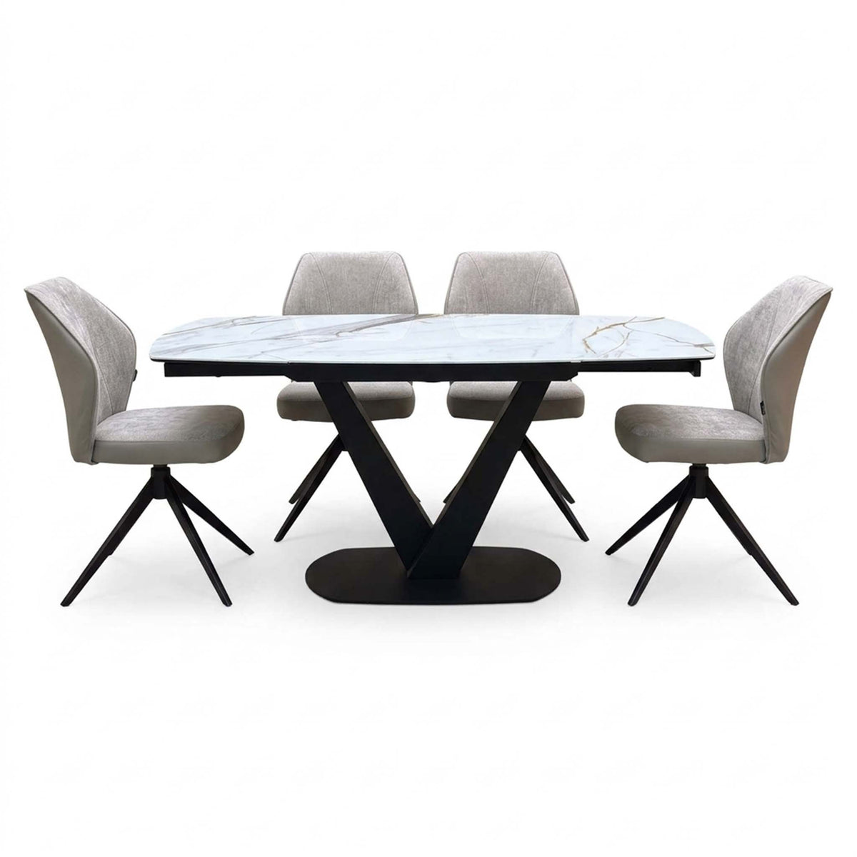 Julio dining set with the gold-veined marble ceramic top and four cream swivel chairs, seen from the front