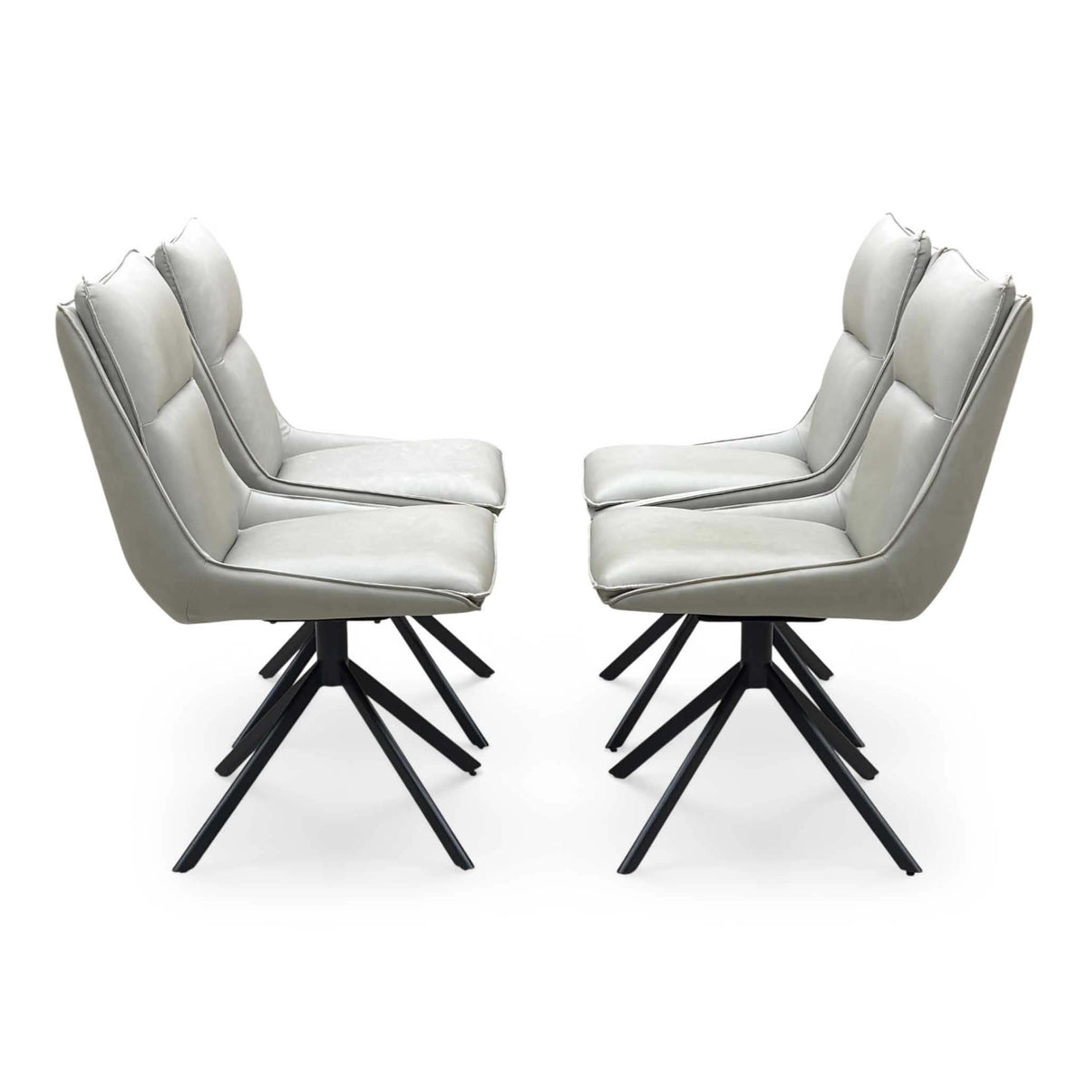 The four taupe faux leather swivel chairs from the Catalina set in two rows, side angle