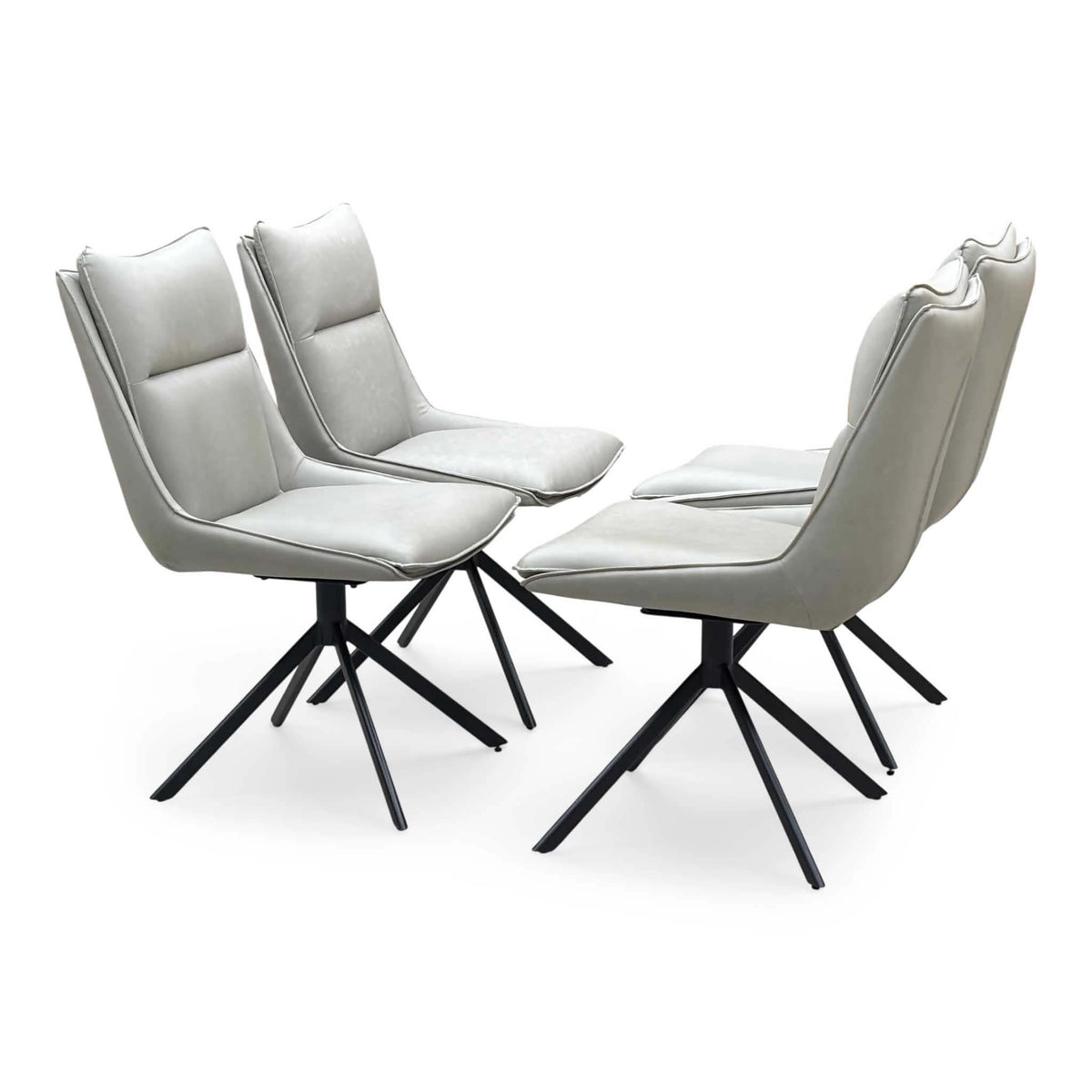 The four taupe faux leather swivel chairs from the Catalina set, angled view showing the black star-shaped legs
